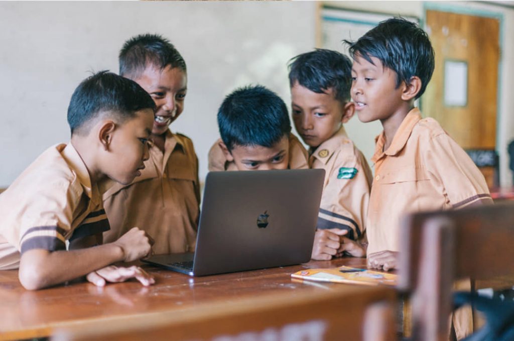 image of kids and a laptop